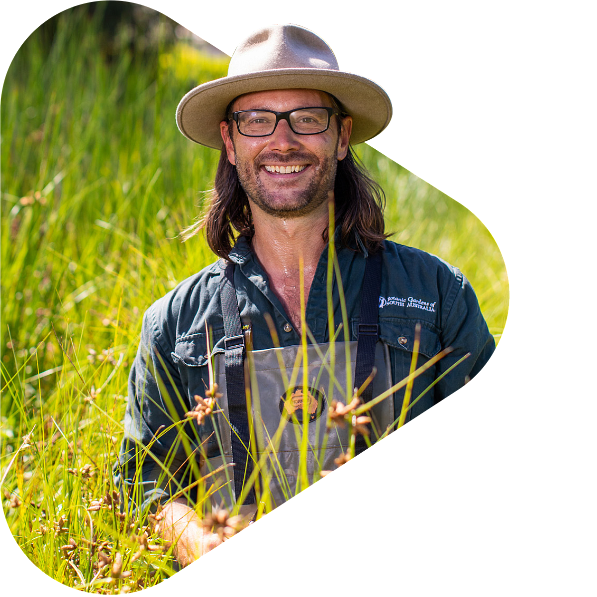 Agriculture apprentice in garden smiling